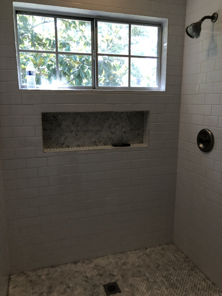 bathroom renovation addind subway tile and a new niche